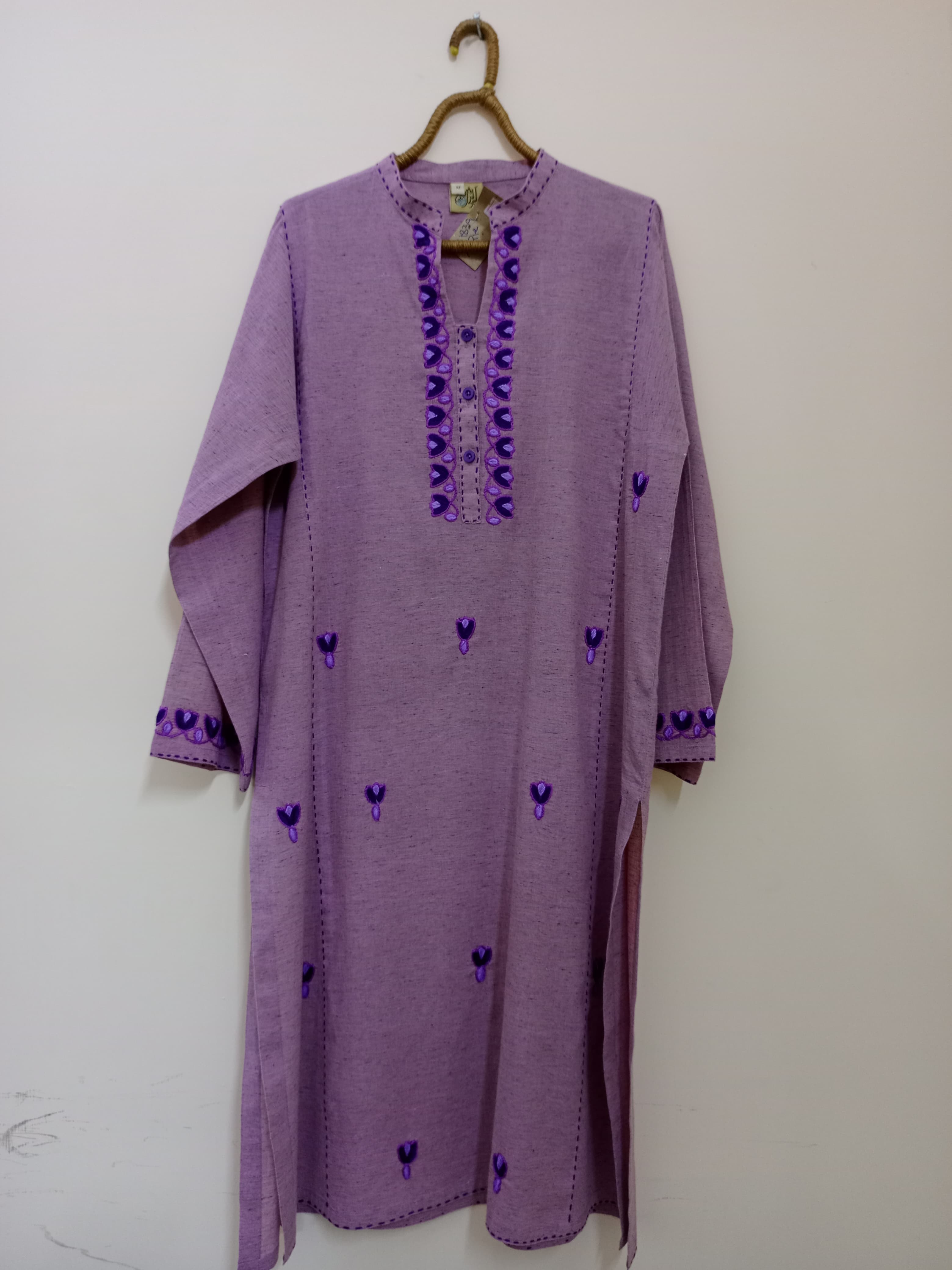 Subtle lavender hue with striking deep purple embroidery on neckline and sleeves. A graceful blend of soft tone and vibrant details, perfect for serene yet statement looks