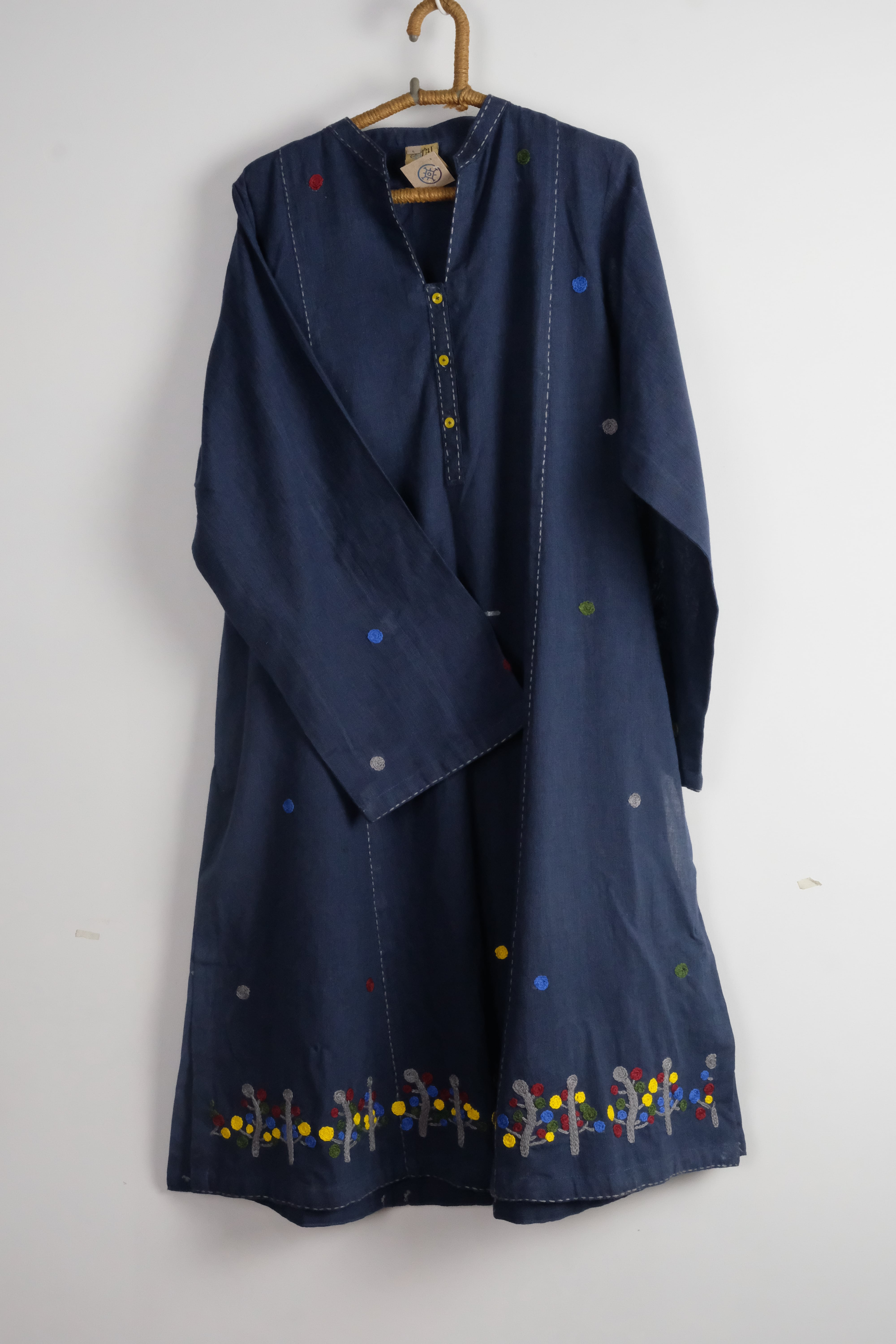 This navy blue kurta features exquisite embroidery and vibrant accents, perfect for a stylish and comfortable everyday look.